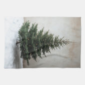 雪の上に柔らかい光を持つミニマルなクリスマスツリー キッチンタオル (横)