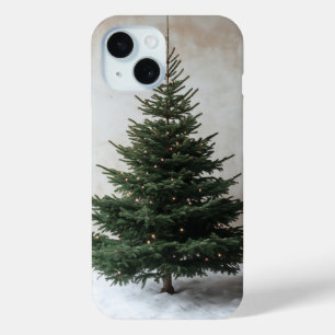 雪の上に柔らかい光を持つミニマルなクリスマスツリー iPhone 15ケース
