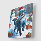 雪の中でクリスマス帽子をかぶったシャム猫 スクエア壁時計 (傾斜)