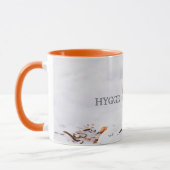 雪の中で可愛いロビンの鳥とハイゲ マグカップ (左)