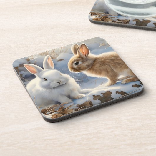 雪の中で茶色と白の愛らしいウサギたち コースター (左側)