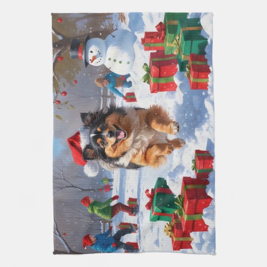 雪の中で走Keeshond Dog Hatとクリスマスハット キッチンタオル (縦)