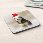 雪の中にサンタハットを持つシベリアのハスキー犬 コースター (左側)