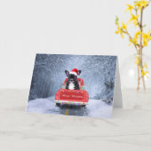 雪の中のクリスマストラックに座るフレンチブルドッグ カード (黄色い花)