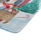 雪の中のジャック・ラッセル犬のクリスマスドッグハウス カッティングボード (角)