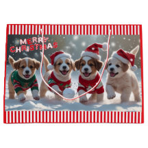 雪の中のセーター遊のクリスマスの子犬