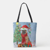 雪の中のドイツの羊飼い犬とクリスマスプレゼント トートバッグ (裏面)