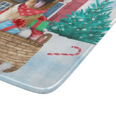 雪の中のドイツの羊飼い犬クリスマスドッグハウス カッティングボード (角)