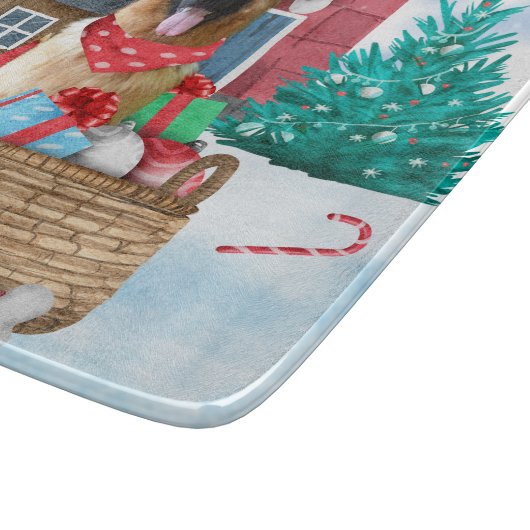 雪の中のドイツの羊飼い犬クリスマスドッグハウス カッティングボード (角)