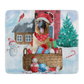 雪の中のドイツの羊飼い犬クリスマスドッグハウス カッティングボード (正面)