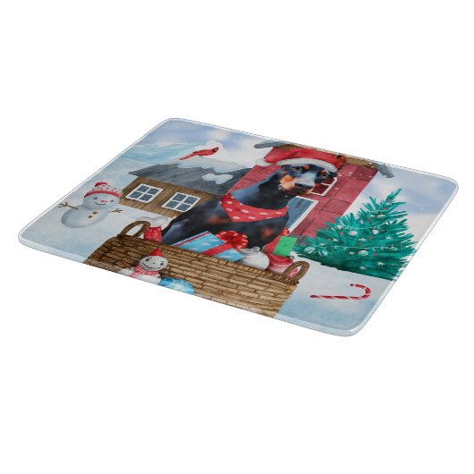 雪の中のドバーマンドッグのクリスマスドッグハウス カッティングボード (角)