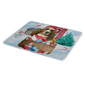 雪の中のバセット犬クリスマスドッグハウス カッティングボード (角)