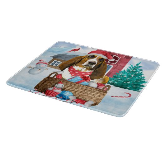 雪の中のバセット犬クリスマスドッグハウス カッティングボード (角)