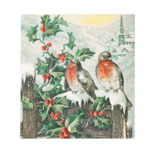 雪の中のフェンスの上に2つのロビン ノートパッド (正面)