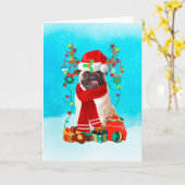 雪の中のプレゼントを抱えたパグ カード (黄色い花)