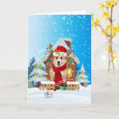 雪の中のプレゼントを持つコーギー カード (黄色い花)