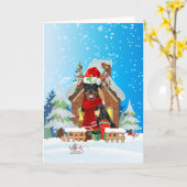 雪の中のプレゼントを持つロットワイラー カード (黄色い花)