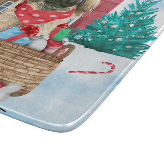 雪の中のペキンゼドッグのクリスマスドッグハウス カッティングボード (角)