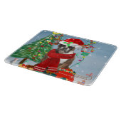 雪の中のボクサー犬とクリスマスプレゼント カッティングボード (角)