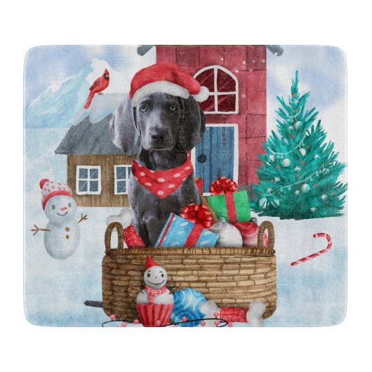 雪の中のワイマラナー犬 クリスマスの犬小屋 カッティングボード (正面)