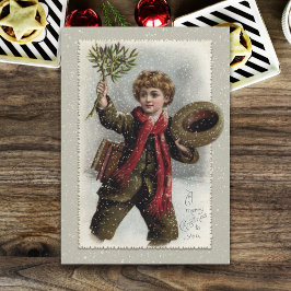 雪の中のヴィンテージの男の子と聖降誕祭お目出度い シーズンカード