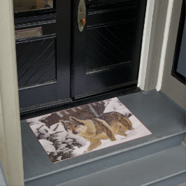 雪の中の大きな美しい灰色の野生の狼 ドアマット