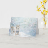 雪の中をボブキャットが飛び交う可愛い森林動物 カード (黄色い花)