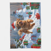 雪の中を走るハバニーズのクリスマス帽 キッチンタオル (縦)