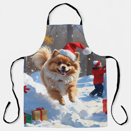 雪の中を走るポメラニアン クリスマス帽をかぶって エプロン (正面)