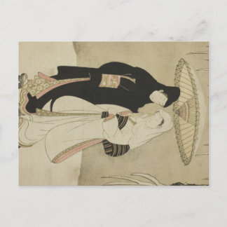 雪の中、傘の下にいる2人の恋人 ポストカード