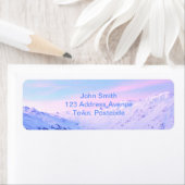 雪の山の上の日の出 ラベル (インサイチュ)