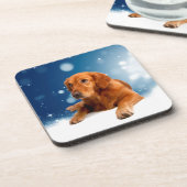 雪の星に座る、かわいいゴールデンレトリバー犬 コースター (左側)