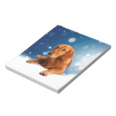 雪の星に座る、かわいいゴールデンレトリバー犬 ノートパッド (回転)
