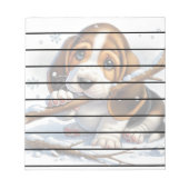 雪の棒を持ったかわいい子犬 ノートパッド (正面)