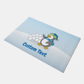 雪の玉を手にしたリトルペンギン ドアマット (アングル)