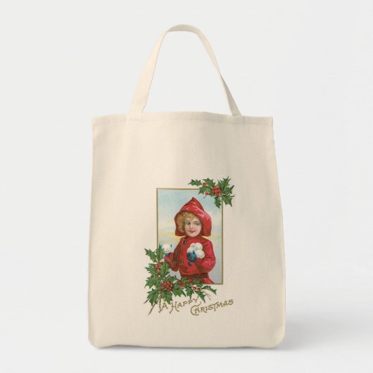 雪の玉を持つクリスマスの少女 トートバッグ (正面)