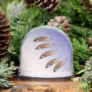 雪の球体 – 茶色の羽毛フローティング