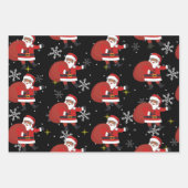 雪の結晶と星のクリスマスを持つブラックサンタ ラッピングペーパーシート (正面)