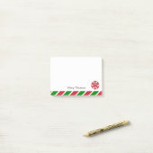 雪の赤と緑のクリスマスストライプの ポストイット (デスク上)