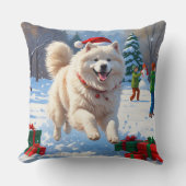 雪の走中のサモエイのクリスマス帽子 クッション (正面)
