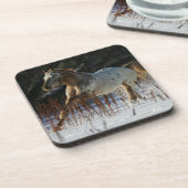 雪のAppaloosaの馬のランニング コースター (左側)