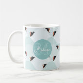 雪よくはしゃぐ模様のペンギン コーヒーマグカップ (左)