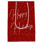 雪片のクリスマスレッド深紅色 ミディアムペーパーバッグ (裏面)