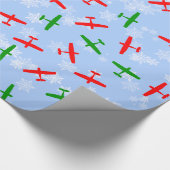 雪片を通した飛んでいるクリスマスセスナス ラッピングペーパー (角)