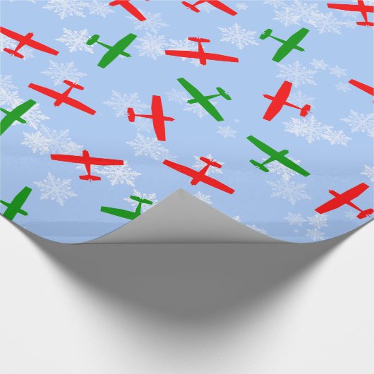 雪片を通した飛んでいるクリスマスセスナス ラッピングペーパー (角)