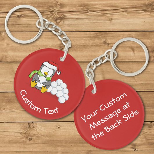 雪玉キーチェーンと座るクリスマスペンギン キーホルダー