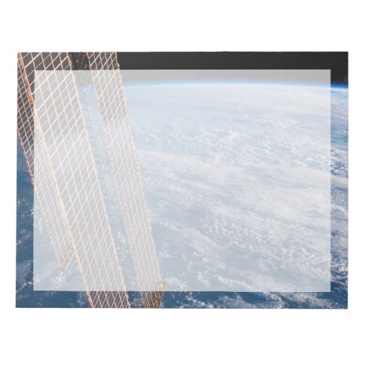 雲に覆われたタスマンとサンゴの海。 ノートパッド (正面)