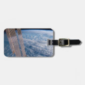 雲に覆われたタスマンとサンゴの海。 ラゲッジタグ (正面横)