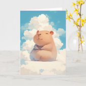 雲の上でリラックスするカピバラ カード (黄色い花)