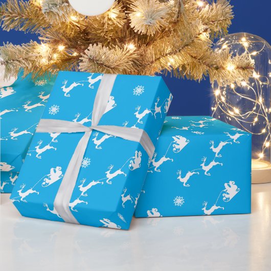 青いそりとサンタとスノーフレーク ラッピングペーパー (クリスマス)